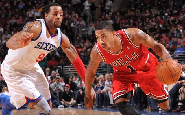 PHILADELPHIA, PA - FEBRUARY 1: Derrick Rose #1 of the Chicago Bulls drives against Andre Iguodala #9 of the Philadelphia 76ers during the game on February 1, 2012 at the Wells Fargo Center in Philadelphia, Pennsylvania. NOTE TO USER: User expressly acknowledges and agrees that, by downloading and/or using this Photograph, user is consenting to the terms and conditions of the Getty Images License Agreement. Mandatory Copyright Notice: Copyright 2012 NBAE (Photo by David Dow/NBAE via Getty Images)